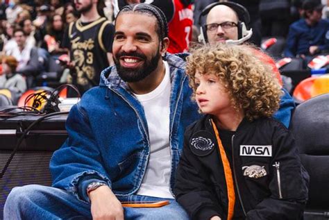 Drake and his 5-year-old son Adonis sit on the sidelines at the Raptors game - Canada Today