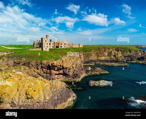 Aerial view from drone of Slains Castle on cliffs near Cruden Bay in Aberdeenshire, Scotland, UK ...