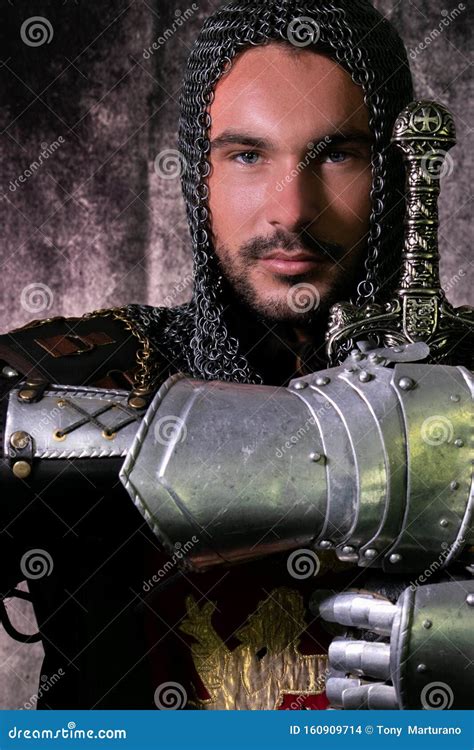 Portrait of Handsome Medieval Knight in Suit of Armour with Beard and Blue Eyes Looking at ...