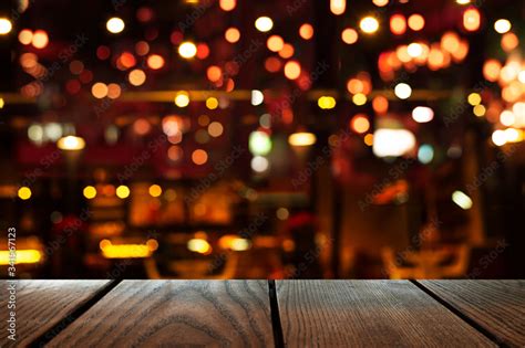 blur bokeh of bar party dark night light background with wood table ...