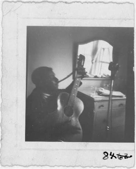 Blind Willie McTell, with 12-string guitar, hotel room, At… | Flickr