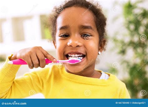 Little Beautiful African Girl Brushing Teeth Stock Photo - Image of checkup, healthcare: 66730440