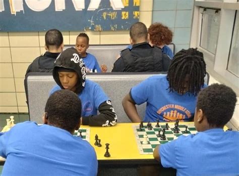 Baychester Middle School students play chess with officers from NYPD’s ...