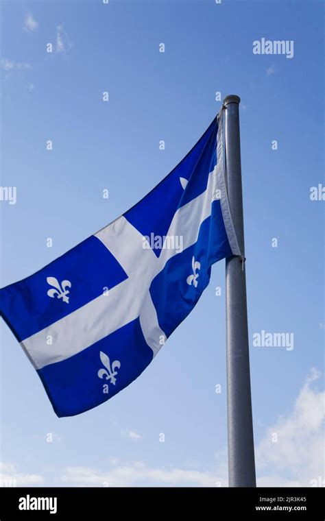 Quebec provincial flag billowing in the wind, Quebec, Canada Stock ...