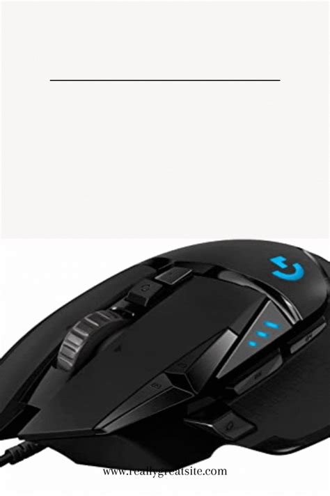 a computer mouse sitting on top of a white table next to a black and blue keyboard