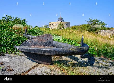 Out and about on the Ertholmen islands, rusty ship's anchor as well as the Great Tower (Store ...