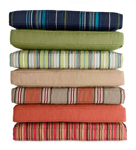 four pillows stacked on top of each other with different colors and patterns in the same row