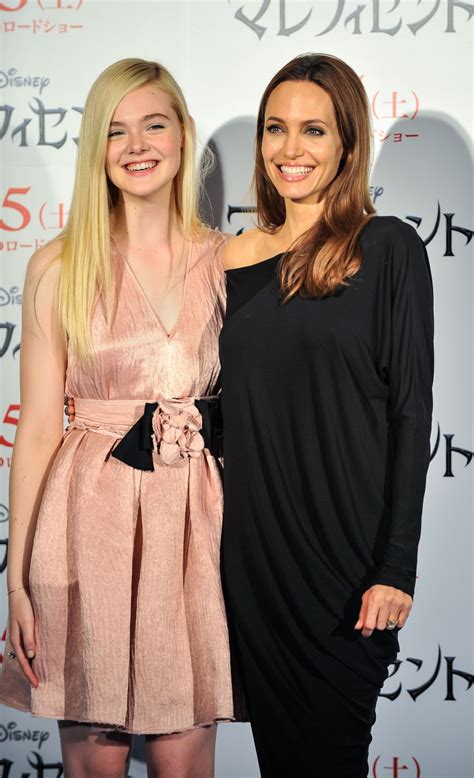 ELLE FANNING and ANGELINA JOLIE at Maleficent Press Conference in Tokyo - HawtCelebs