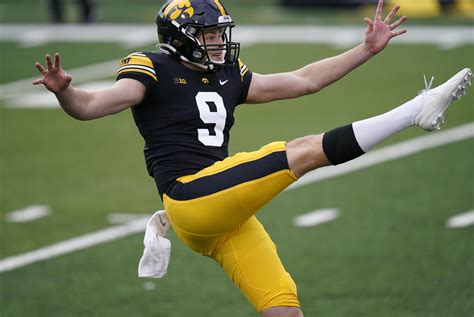 'Punting Is Winning' shirts symbolize No. 2 Hawkeyes' season | AP News