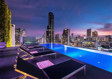 Amara Bangkok hotel's infinity pool and rooftop bar with stunning view of the city skyline ...