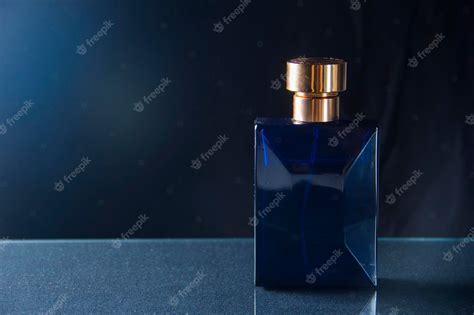 Premium Photo | Black bottle of men's perfume on a dark background