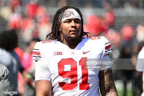 Tyleik Williams of the Ohio State Buckeyes walks off the field... News ...