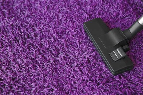 Premium Photo | Vacuum cleaner on carpet
