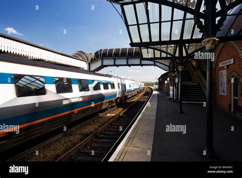 Moving Train passing a platform at Wellingborough train station ...