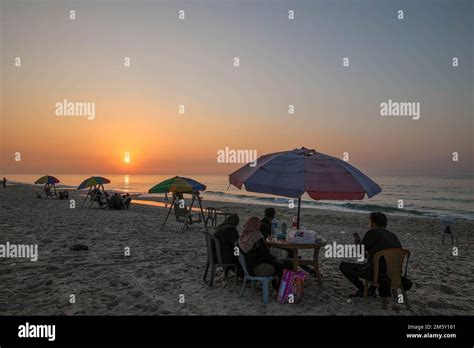 Palestinians enjoy in the beach of Gaza city during the last sunset of ...