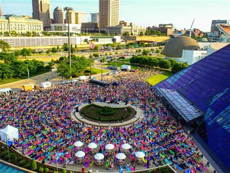 an aerial view of a large group of people gathered in the center of a city