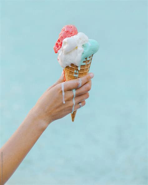 "Hand With Melting Ice Cream" by Stocksy Contributor "Duet Postscriptum" - Stocksy