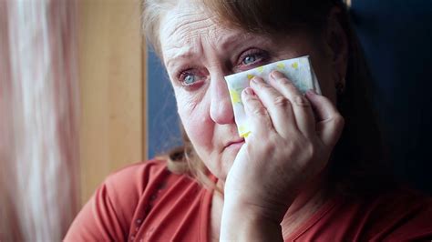 Elderly woman crying wiping her tears with a handkerchief Stock Video Footage - Storyblocks