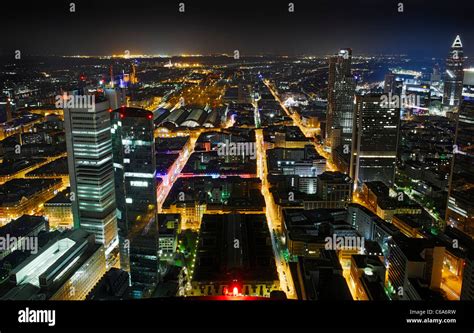 Panoramic view from the Main Tower across Frankfurt am Main at night, colourful lights ...