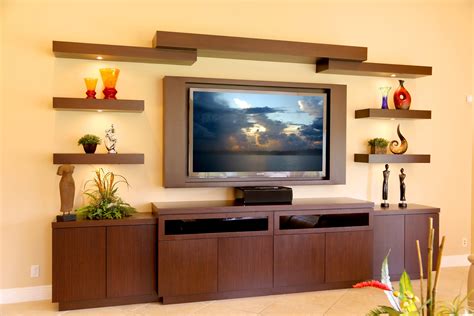 This is a custom entertainment center located in Lake Worth. This unit is made out of wenge. It ...