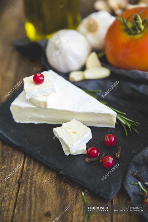 Tasty cheese board with camembert over wooden table — Dairy Product ...