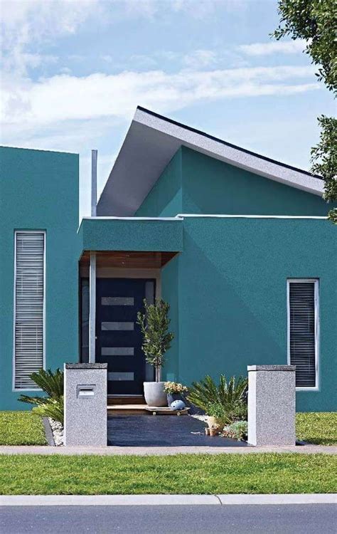 a blue house with a black front door