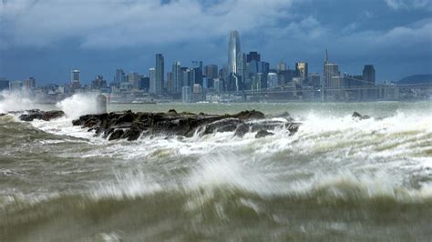 Second atmospheric river in days blows into California, knocking out power and flooding roads ...