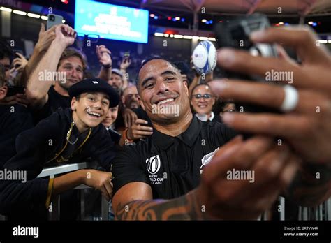 New Zealand's Aaron Smith poses for a a selfie with fans following during the Rugby World Cup ...