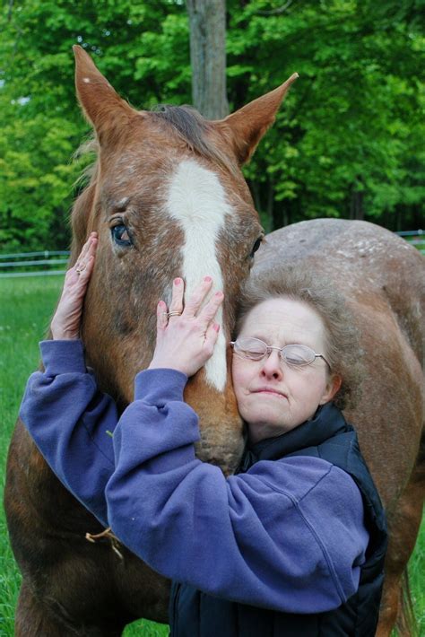 My aunt (who has Downs Syndrome) w/ my blind horse, Sioux....together ...