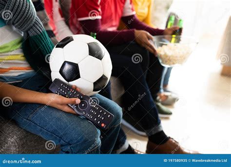 Mid Section of Family Watching Sports on TV at Home Stock Image - Image of father, adult: 197580935