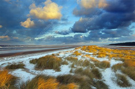 Sunset on Holkham Beach with a dusting of snow, UK - Stock Image - C042 ...