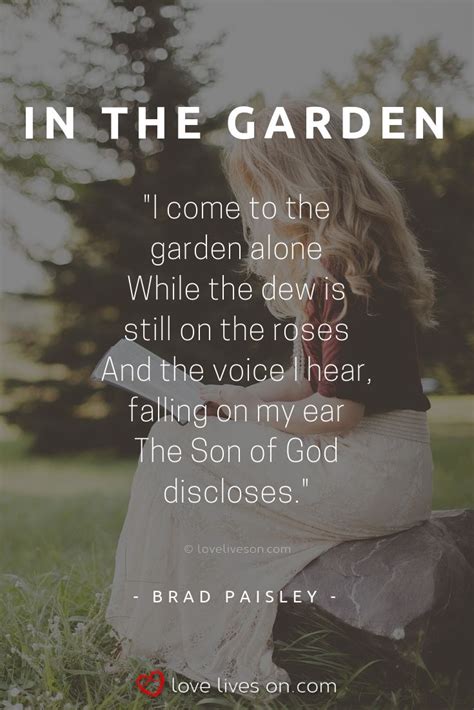 a woman sitting in the grass with a quote from brad paisley