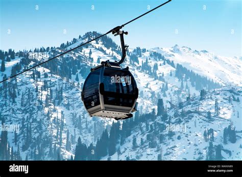 Ski lift, Gondola lift, cable car at Medeo to Shymbulak route near Almaty against mountain ...