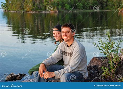 Couple together at Sunset stock photo. Image of waters - 18264860