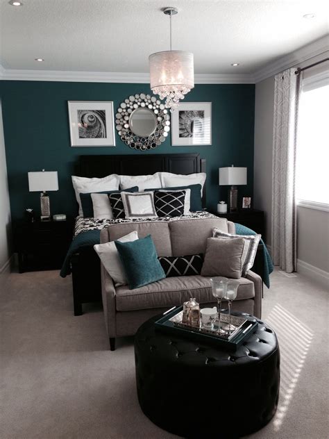 Bedroom with a beautiful green or teal feature, accent wall and black accents. | Remodel bedroom ...