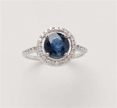 Blue Sapphire Halo Ring by Sampat Jewelers Inc.