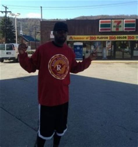 Randy Moss returns home to 7-Eleven at Rand University, takes picture by dumpster