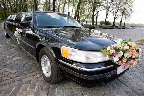 Black Wedding Limousine. Ornated with flowers. – Stock Editorial Photo © edfoto #4452200