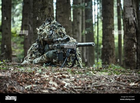 sniper wearing ghillie suit Stock Photo - Alamy