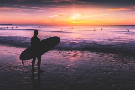 Surfer At Sunset Royalty-Free Stock Photo