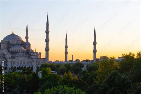 Blue Mosque at night with golden illumination, wide view of Istanbul in dusk. Sultanahmet Camii ...