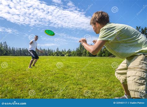 Boys Playing A Frisbee Royalty Free Stock Photography - Image: 32940117