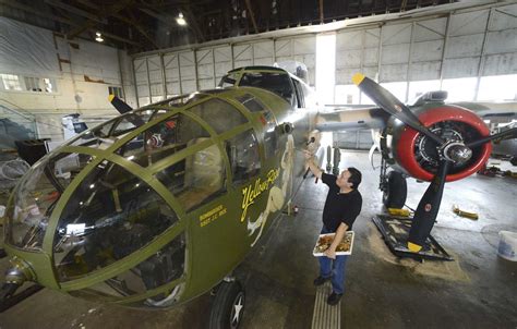 Artist restores luster to airplane nose art on World War II bomber - San Antonio Express-News