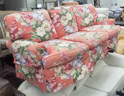 RALPH LAUREN SOFA, three seater, in a floral pattern on a red ground on square supports, 207cm L.