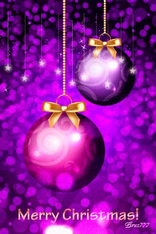 two christmas balls hanging from strings against a purple background with stars and sparkles in ...