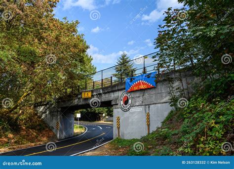 Funny Sign on Railroad Bridge Over City Street, Warning To Tall Trucks that the Bridge Has L ...