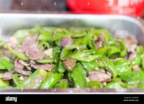 Chinese food, fried green Chili and gizzards in a food plate Stock Photo - Alamy