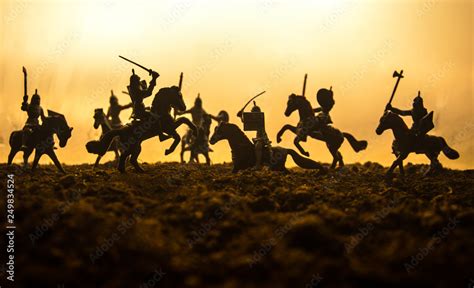Medieval battle scene with cavalry and infantry. Silhouettes of figures as separate objects ...