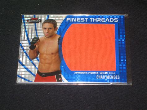 Download UFC Star Chad Mendes Displaying His Memorabilia Card Wallpaper ...