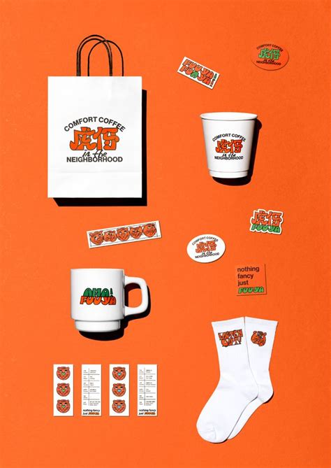 coffee cups and stickers are on an orange surface